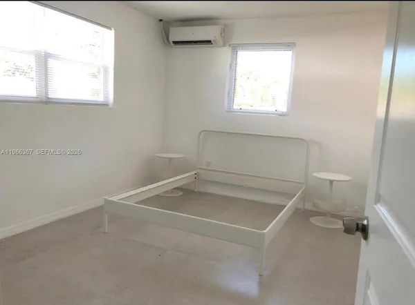 a bathroom with a sink a toilet and window