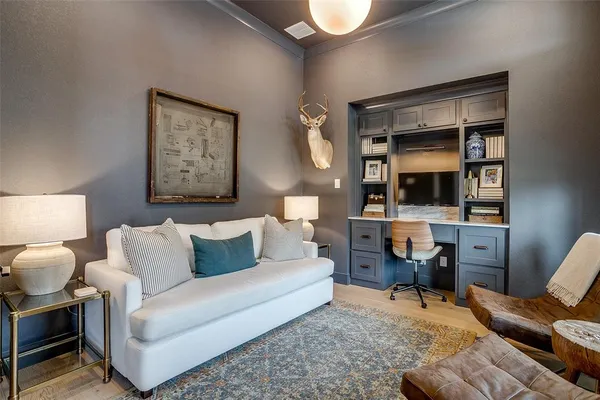 a living room with furniture and a lamp