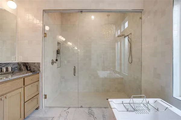 a bathroom with a shower and a sink