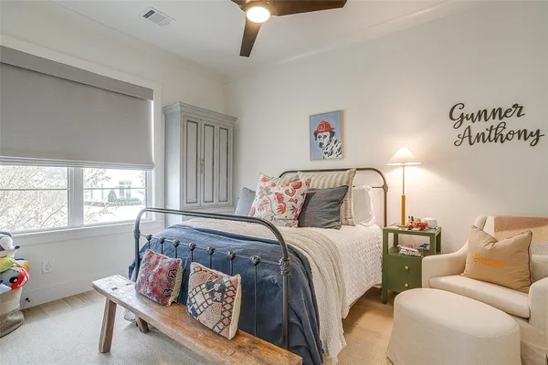 a bedroom with bed and window