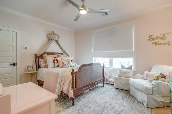 a bedroom with furniture and a window