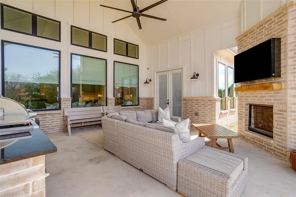a living room with furniture fireplace and flat screen tv