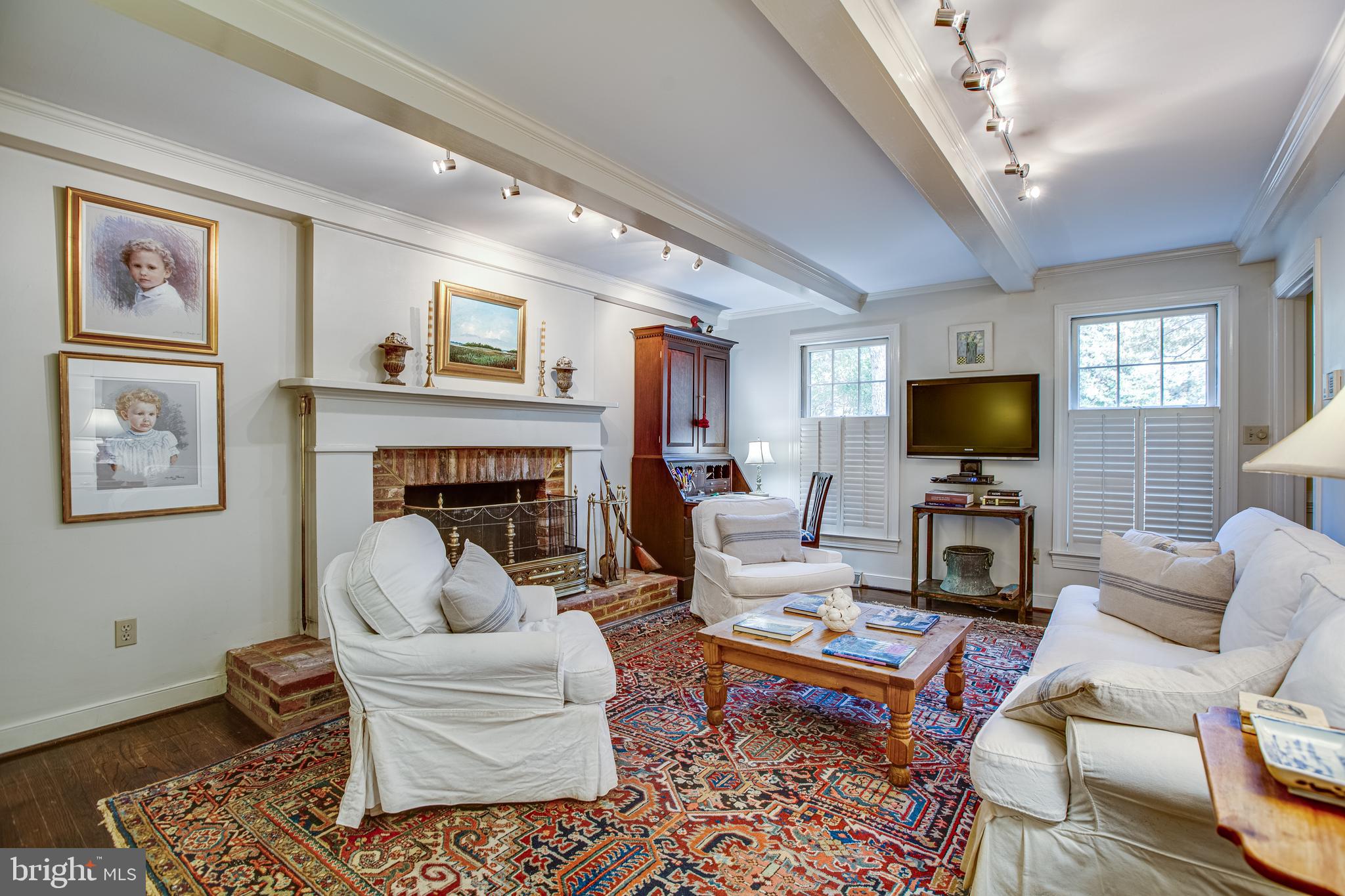 20 Aiken Road Fredericksburg, VA 22405 - Photo 11 of 33 a living room with furniture a flat screen tv and a fireplace