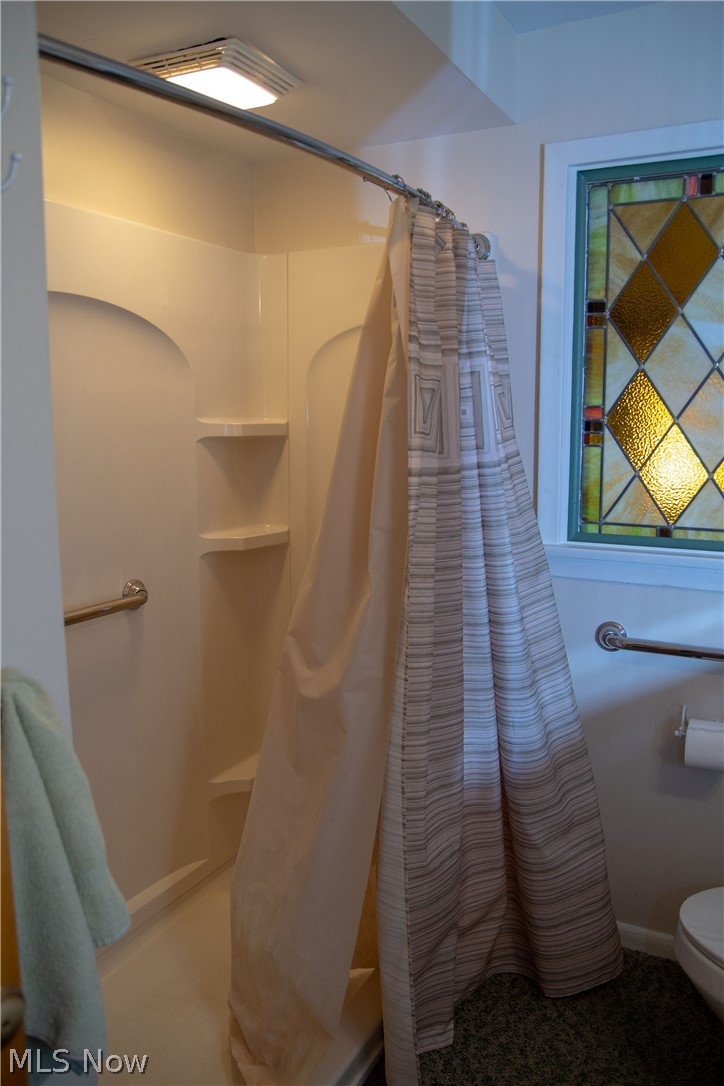 926 Ridge Road Northwest Canton, OH 44703 - Photo 15 of 35 Full-size walk-in shower (no tub) installed in Spring of 2018. Beautiful stained glass window conveys,