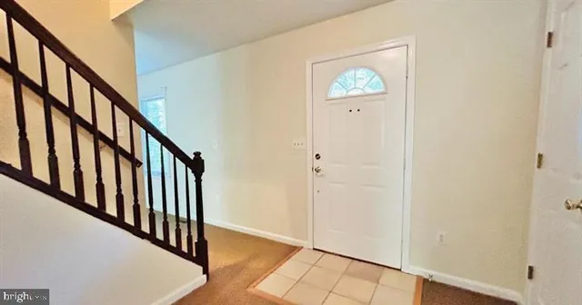 a view of an entryway with wooden floor