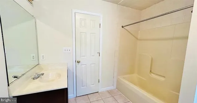 a bathroom with a sink and a bathtub