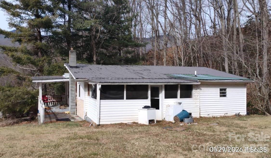 337 Red Bank Road Waynesville, NC 28786 - Photo 6 of 9 a house with trees in the background