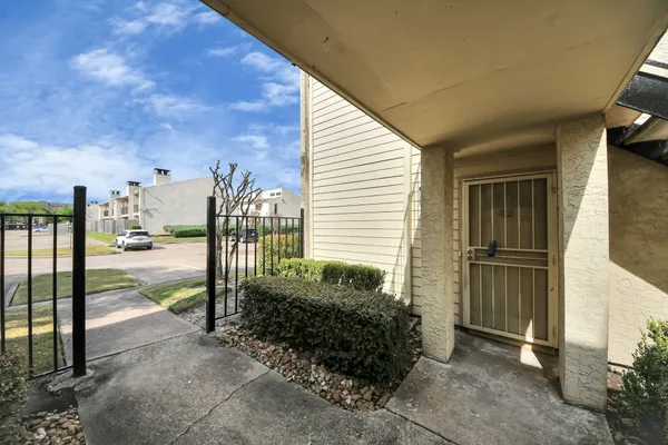 a view of a balcony with door