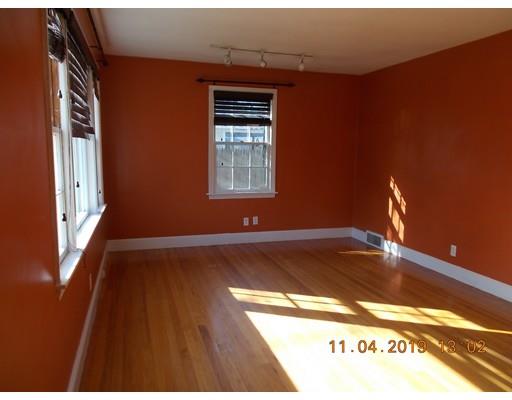 242 Plumtree Road Springfield, MA 01118 - Photo 4 of 22 a view of empty room with wooden floor and fan