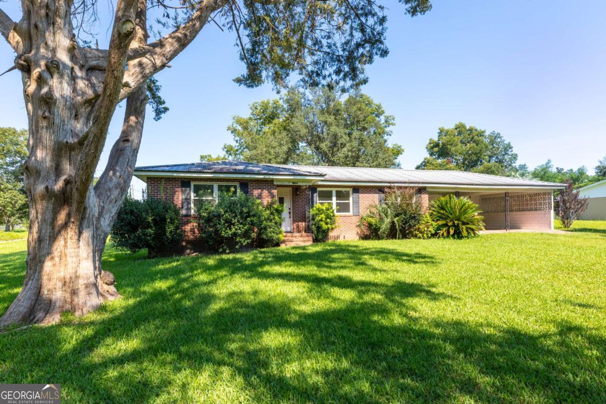 front view of a house with a yard