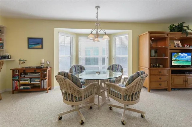 a dining room with furniture and window