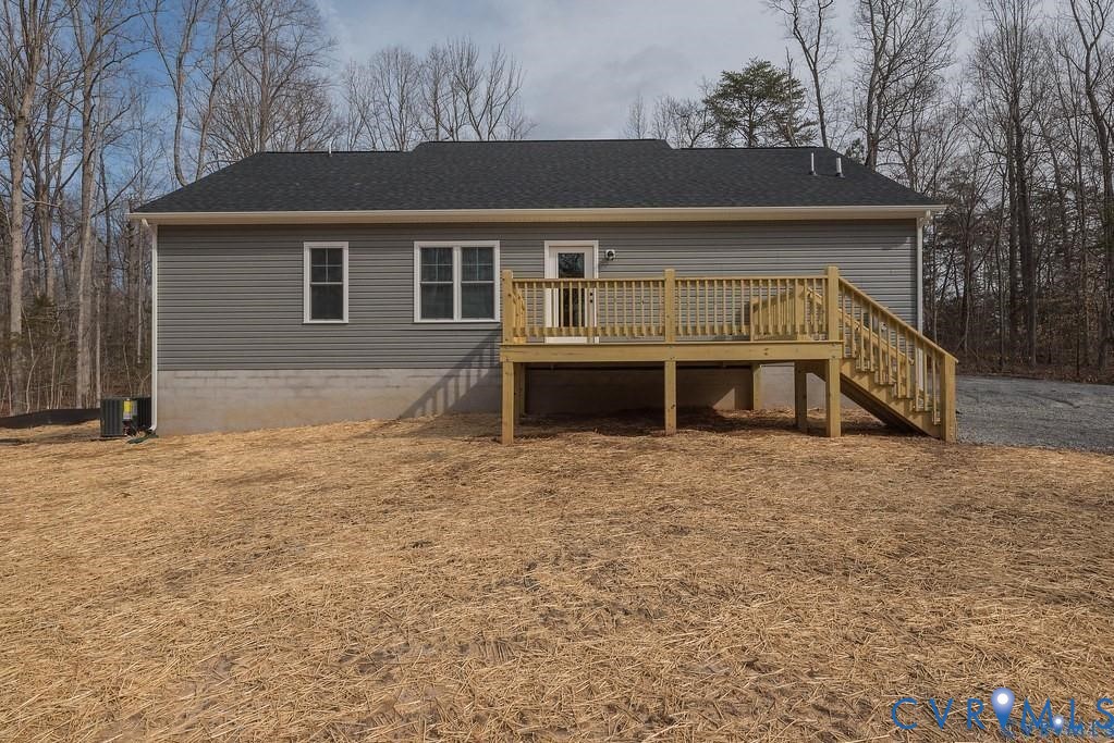 2223 Ridge Road Arvonia, VA 23004 - Photo 32 of 32 Rear exterior with a wooden deck, gray horizontal