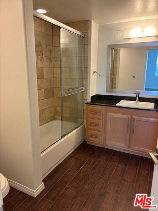11925 Kling Street, Unit 311 Valley Village, CA 91607 - Photo 21 of 25 a bathroom with a sink a mirror and a bathtub