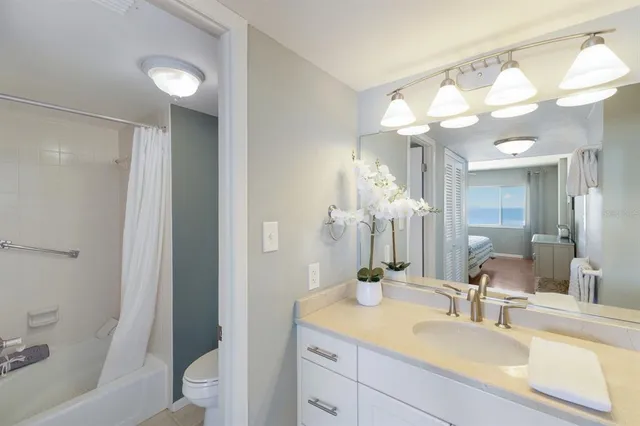 a view of a water fountain and a building in the background