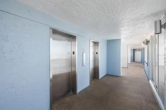 a view of a dining room with furniture and windows