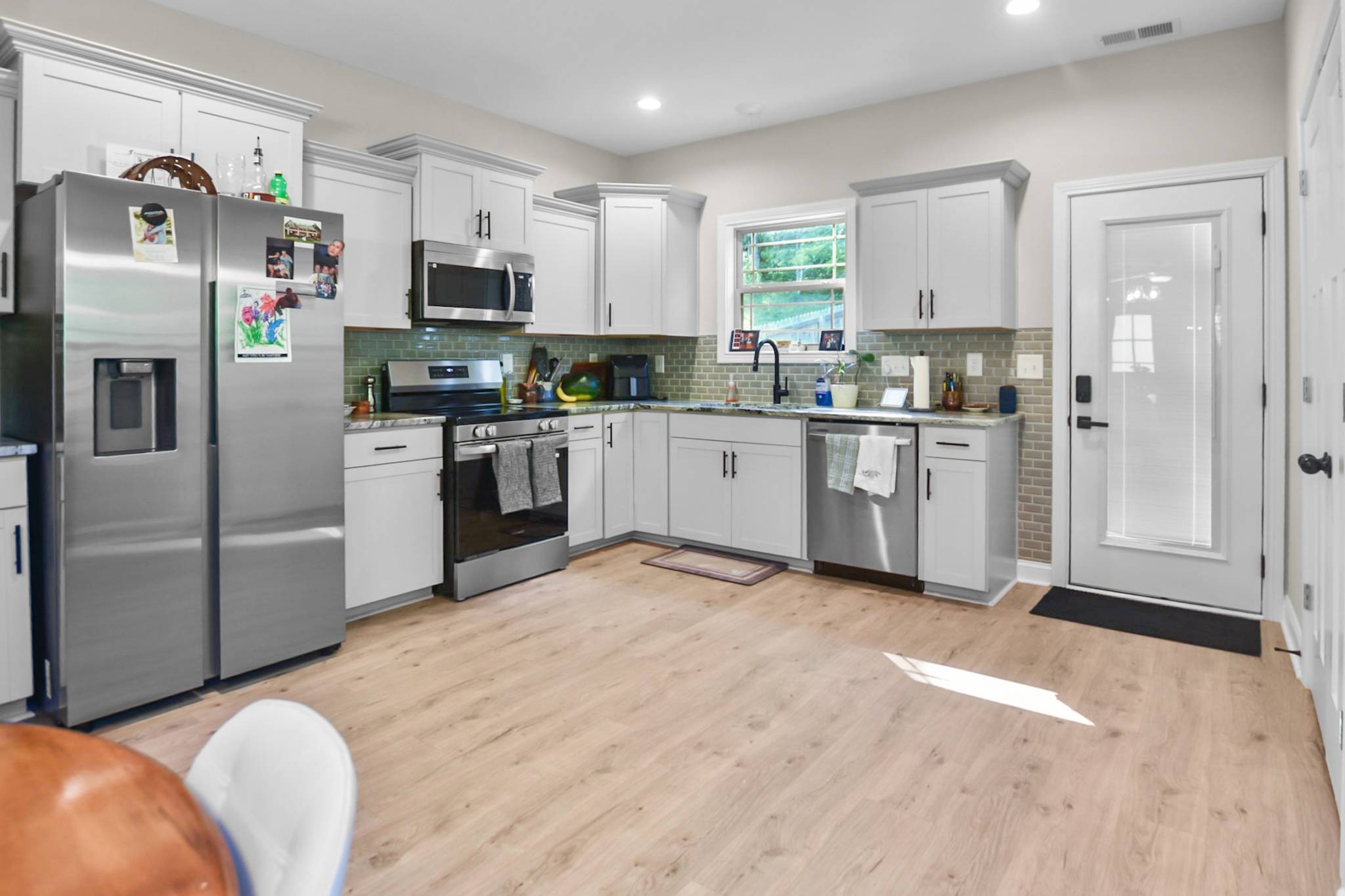 60 Cave Springs Road, Unit B Clarksville, TN 37042 - Photo 6 of 16 a kitchen with cabinets and stainless steel appliances