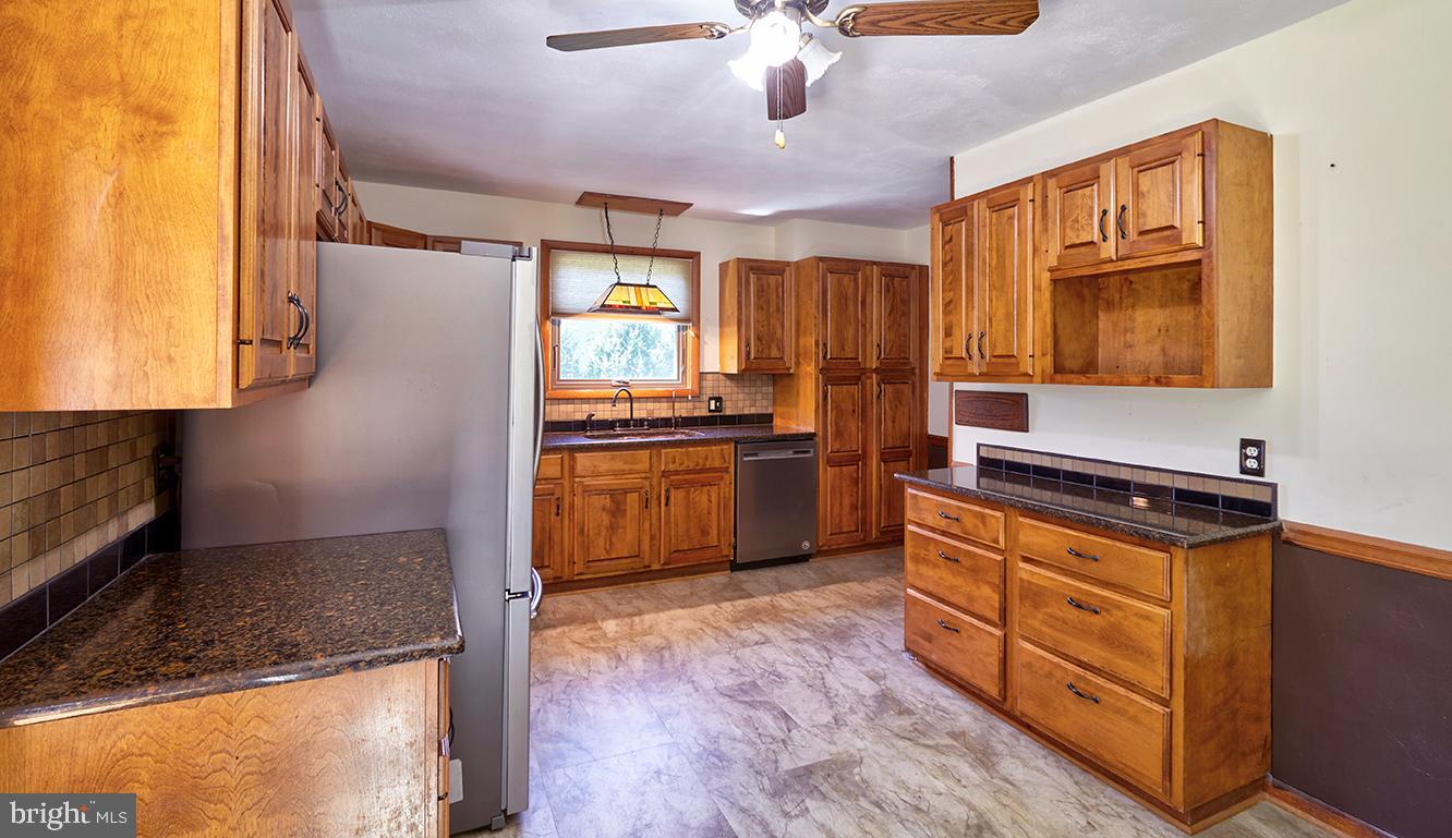9 Chesterfield Georgetown Road Chesterfield, NJ 08515 - Photo 14 of 47 a kitchen with stainless steel appliances granite countertop a stove a sink and a microwave