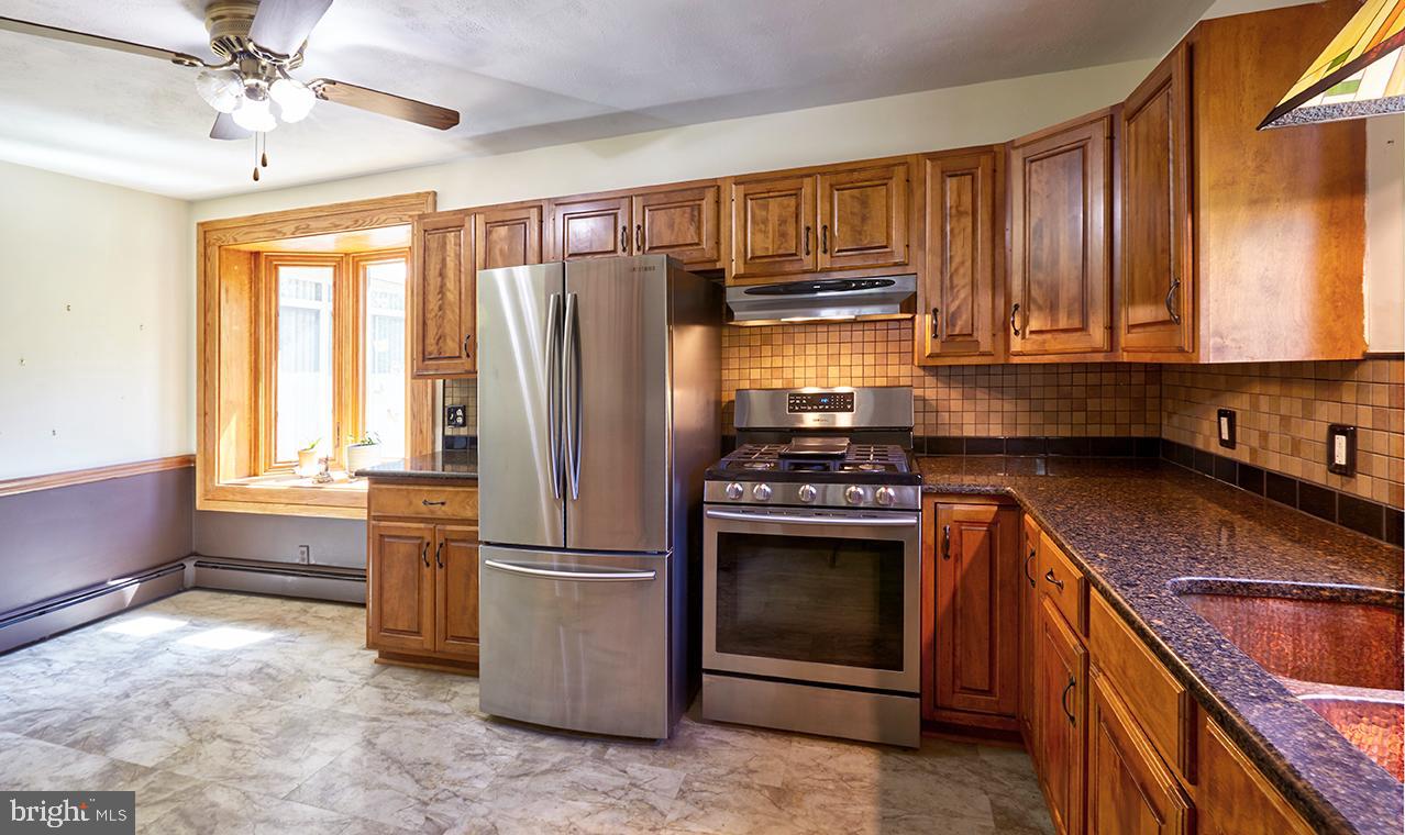 9 Chesterfield Georgetown Road Chesterfield, NJ 08515 - Photo 15 of 47 a kitchen with stainless steel appliances granite countertop a stove a refrigerator and a sink