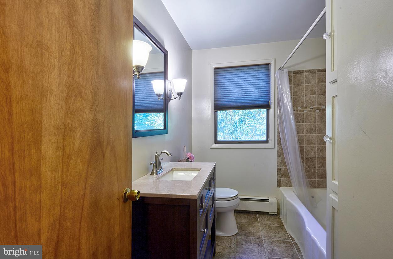 9 Chesterfield Georgetown Road Chesterfield, NJ 08515 - Photo 24 of 47 a bathroom with a sink a toilet and tub