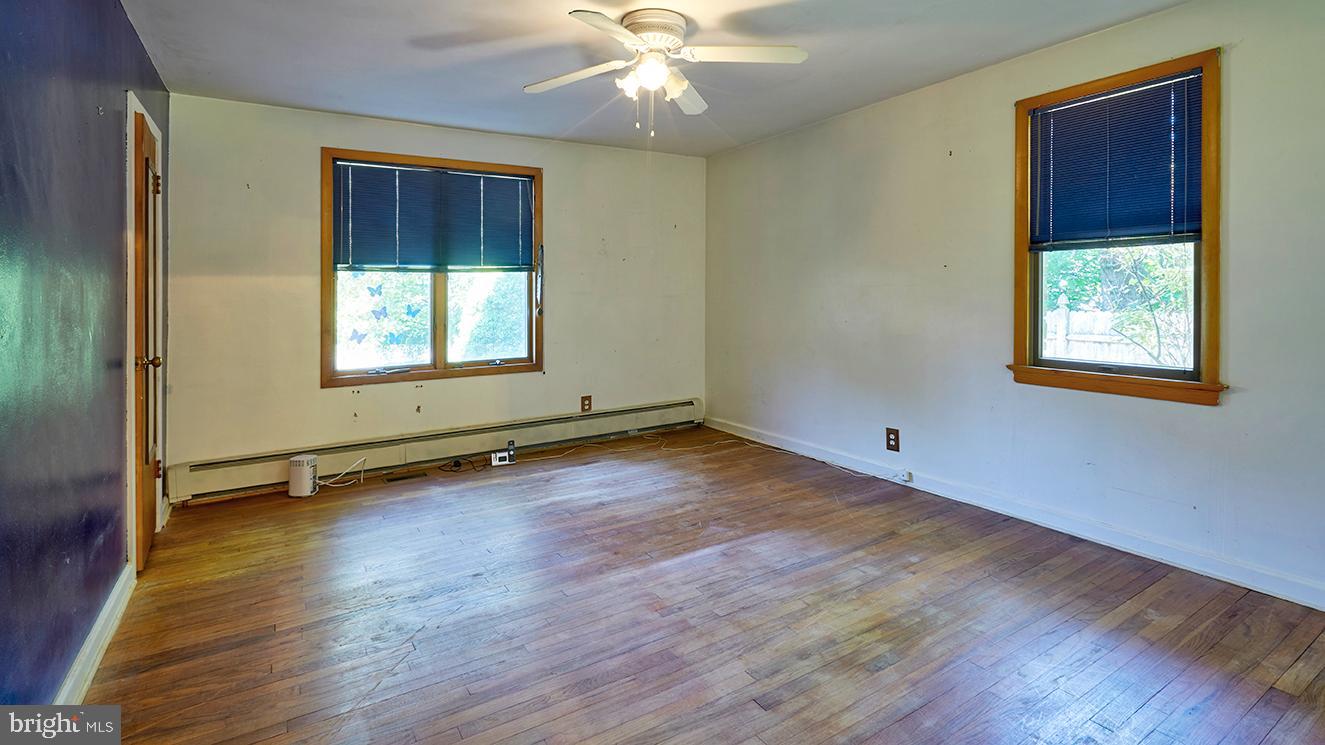 9 Chesterfield Georgetown Road Chesterfield, NJ 08515 - Photo 28 of 47 a view of an empty room with wooden floor and a window