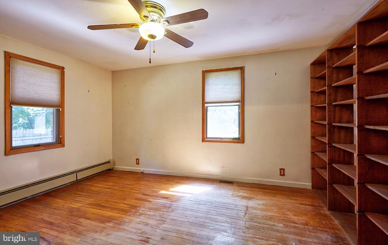 9 Chesterfield Georgetown Road Chesterfield, NJ 08515 - Photo 31 of 47 a view of an empty room with a window and wooden floor