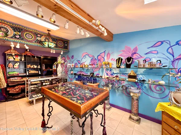 a room with furniture toys and a large window