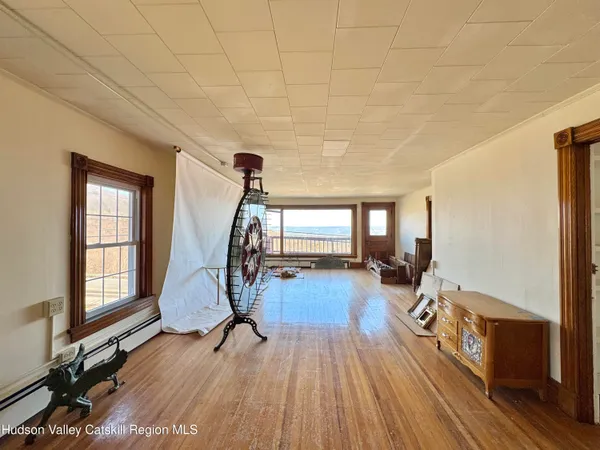 a view of entryway with wooden floor