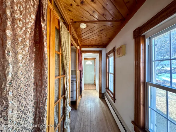 a large white kitchen with a large window