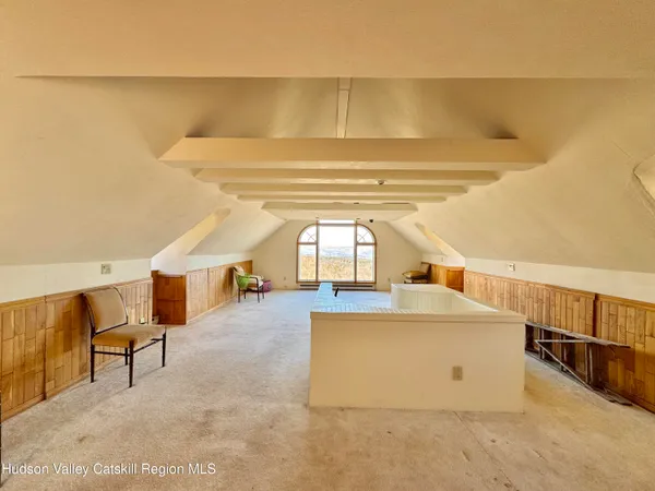 a view of a hallway with windows