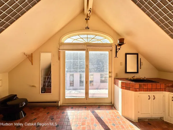 a view of a livingroom with furniture and a fireplace