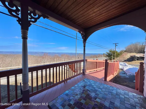 a view of balcony with a potted plant