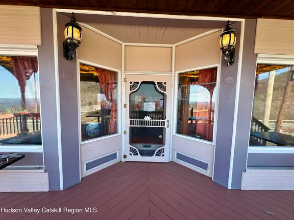 a view of living room with furniture and wooden floor