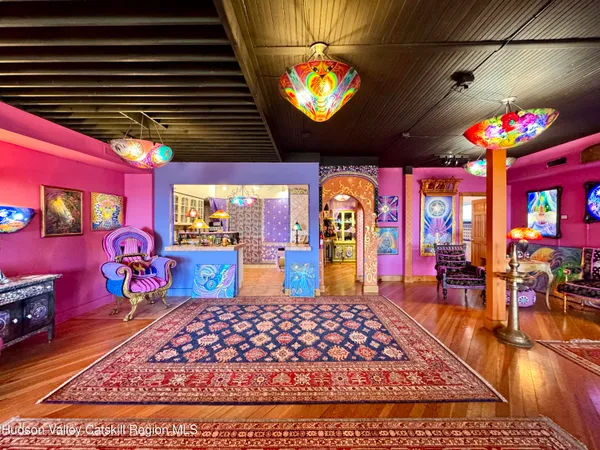 a group of people sitting in front of retail shop