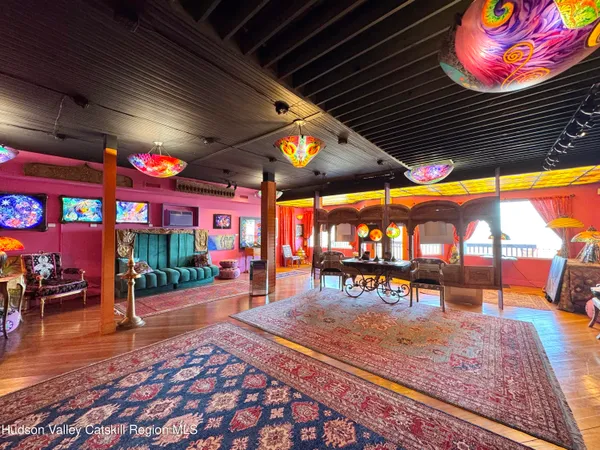 an outdoor sitting area with a table and chairs