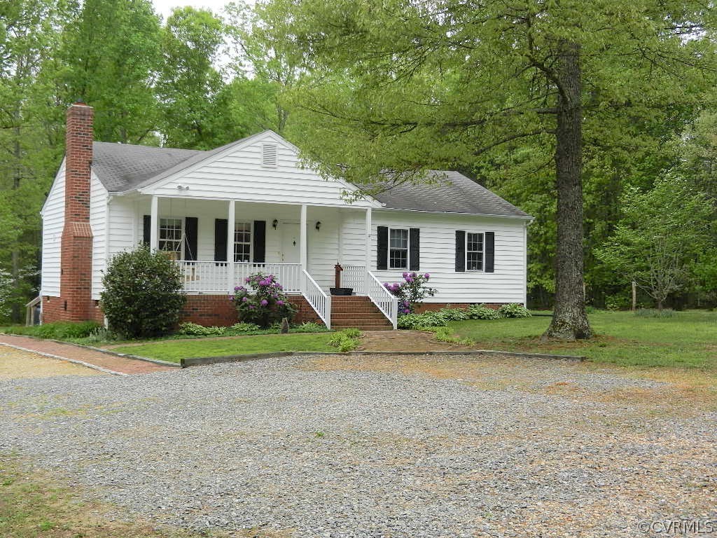 20801 Beaver Dam Road Beaverdam, VA 23015 - Photo 1 of 50 a front view of a house with garden