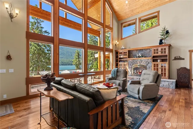 a living room with furniture and a floor to ceiling window