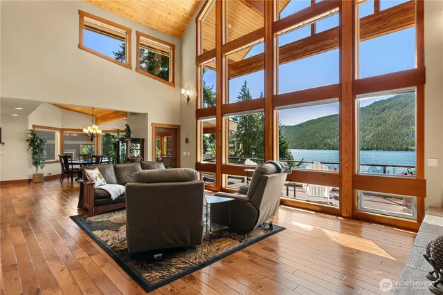 a living room with furniture and a floor to ceiling window