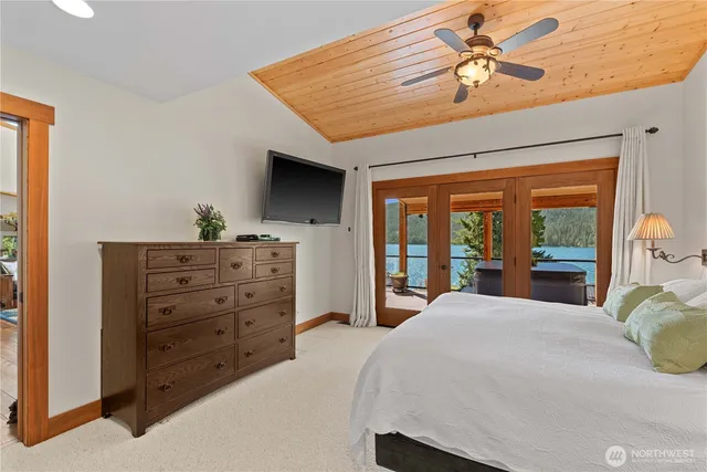 a bedroom with a large bed and a window