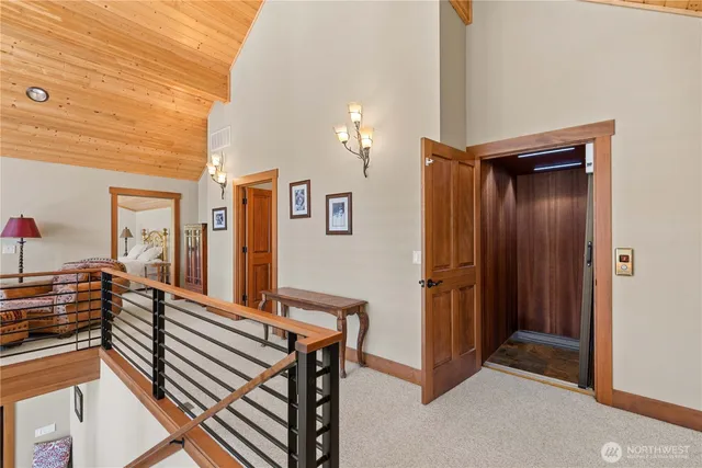 a view of a balcony with furniture and a potted plant