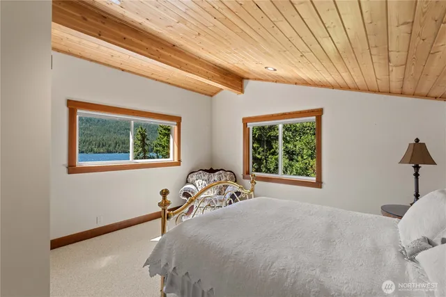 a bedroom with furniture and a window