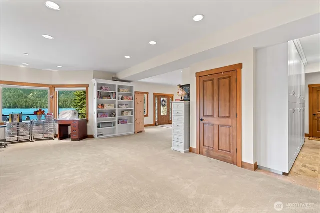 an empty room with closet and mirror