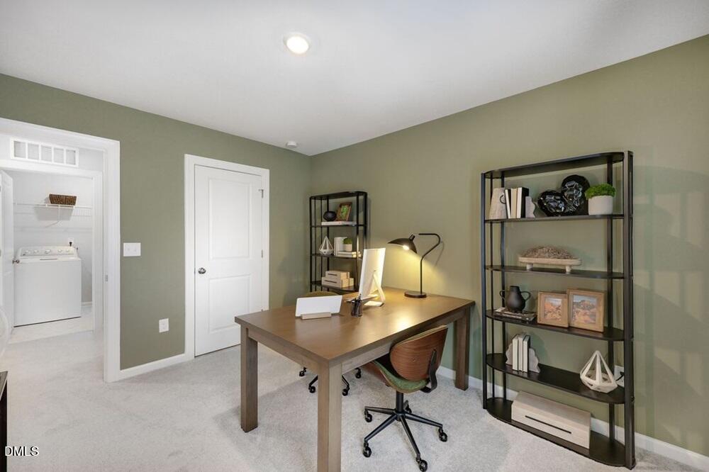 1324 West Garner Road, Unit 104 Garner, NC 27529 - Photo 9 of 23 a view of a workspace with furniture