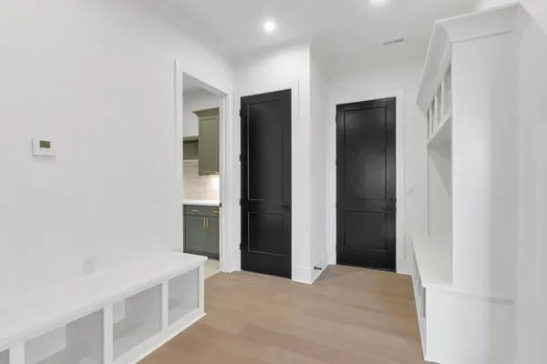 a kitchen with a sink cabinets and utility