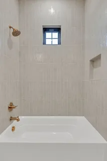 a view of a brick house with a large window