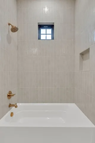 a view of a brick house with a large window