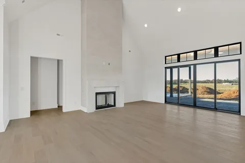 a kitchen with kitchen island granite countertop a sink a counter space appliances and cabinets