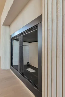 a large kitchen with kitchen island a stove a sink a center island and windows