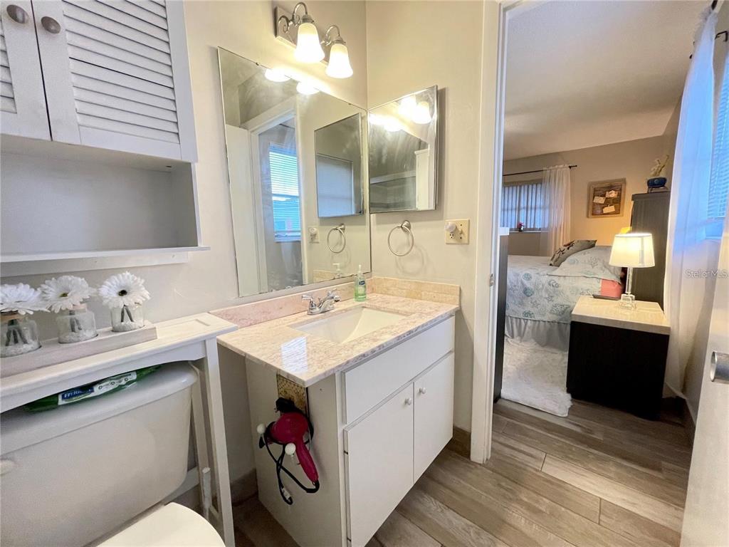 3495 Tree Line Court, Unit 8 Sarasota, FL 34231 - Photo 25 of 40 a bathroom with a sink and a mirror