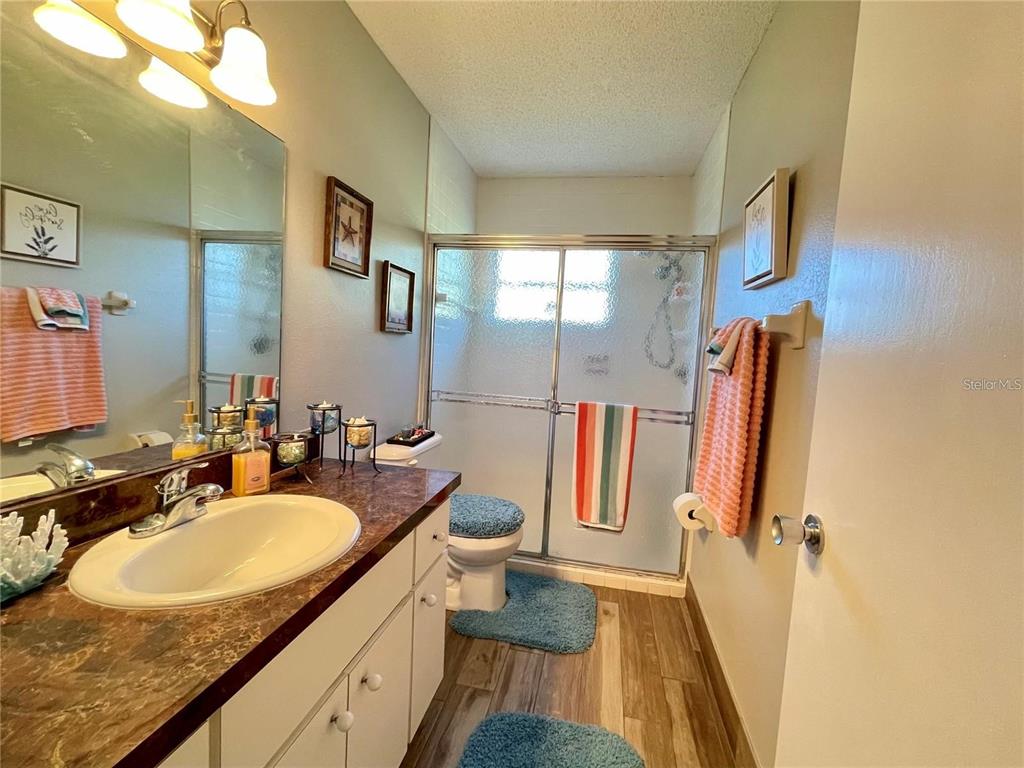 3495 Tree Line Court, Unit 8 Sarasota, FL 34231 - Photo 27 of 40 a bathroom with a sink double vanity and a mirror