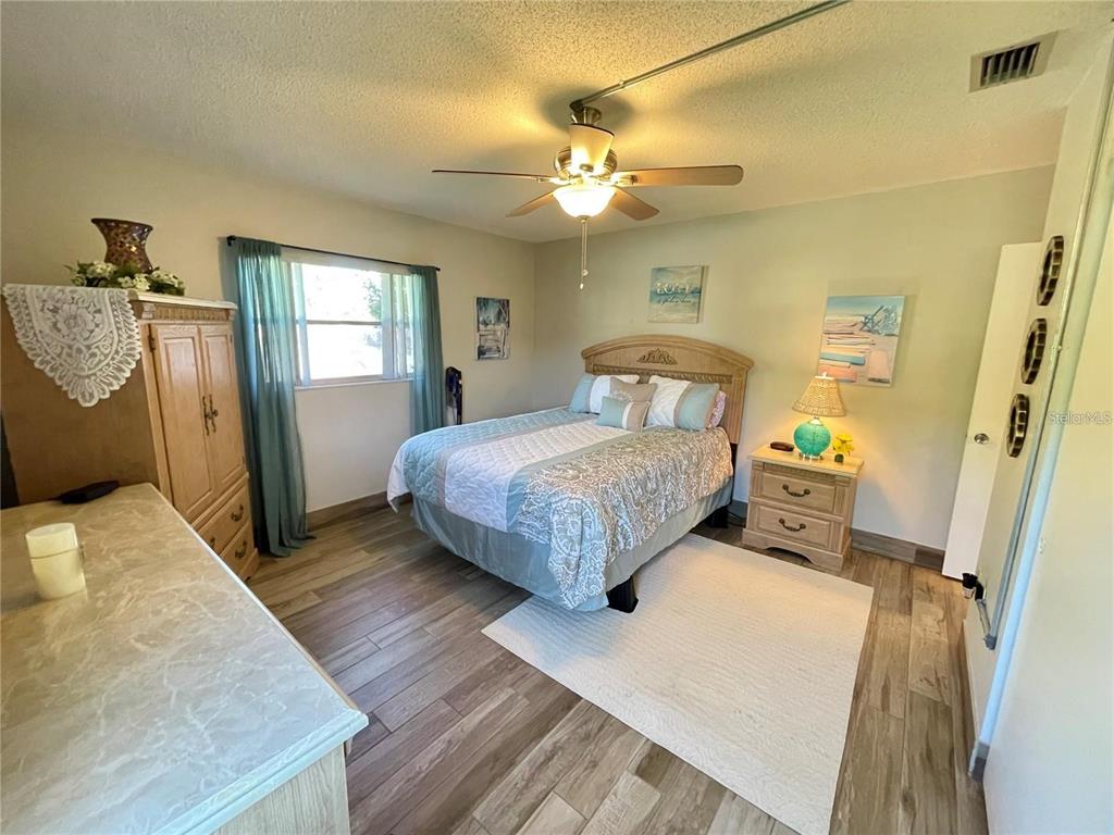 3495 Tree Line Court, Unit 8 Sarasota, FL 34231 - Photo 30 of 40 a bedroom with a bed and window